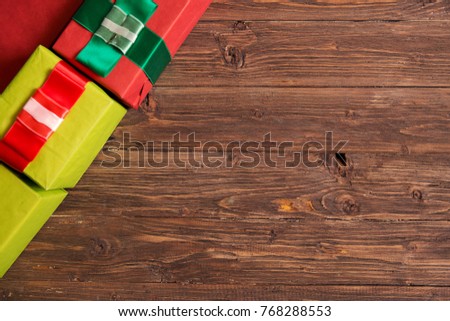 Christmas brown wooden background with Christmas gift.