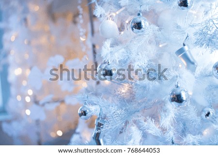 Christmas  background in white with white Christmas tree. closeup shot. blurred background