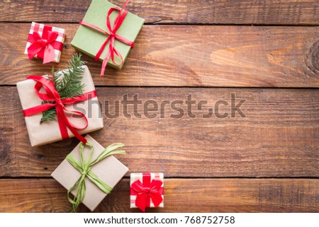 Christmas gifts on a wooden background.