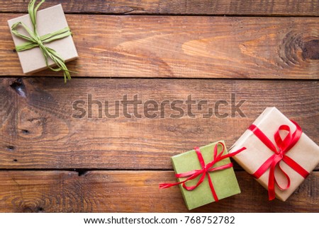Christmas gifts on a wooden background.