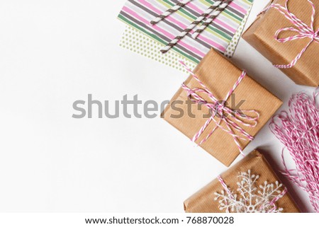 Set of festive gifts in decorative packaging on a white background with copy space, concept of holiday christmas, valentine's day, birthday flat view