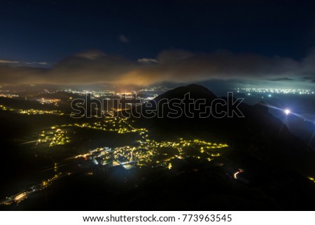 Fog and clouds cover old mountain village Jiufen and Jinguashi after sunset, the most famous old town in Taiwan.