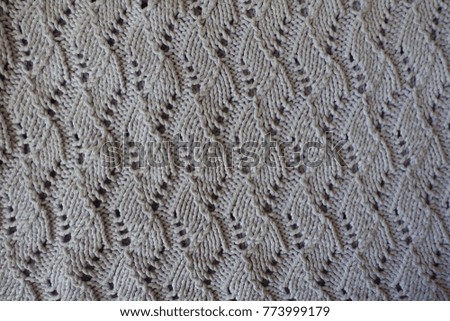Grey handmade lacy knitted fabric from above