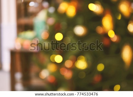 Illuminated Christmas tree on indistinct blurred background. Christmas background.