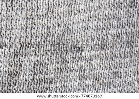 Knitted texture background of wool. Fabric close up photo