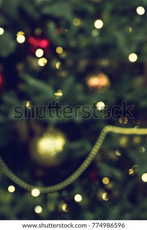 Blurred Christmas background. Christmas tree with toys blurred.