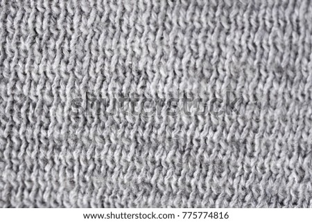 Knitted texture background of wool. Fabric close up photo