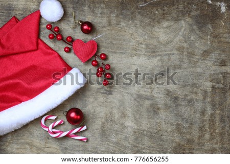red santa hat on a textured wooden background