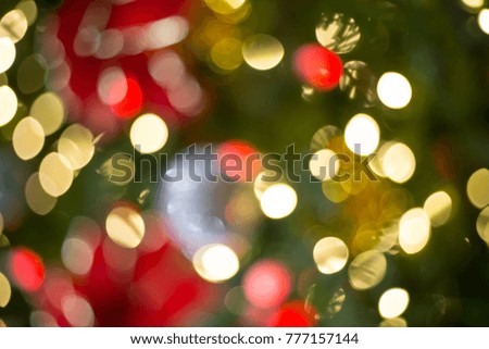 Colorful Red, Yellow and Green Christmas Tree Bokeh background of de focused glittering lights
