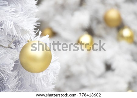 Gold ball on white branch of chrismas tree background (Decoration for Christmas and New year festival