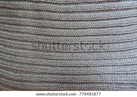 Grey handmade knitted fabric with horizontal wales
