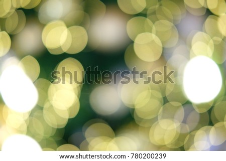 The bokeh of the Chrismas light is yellow and green.