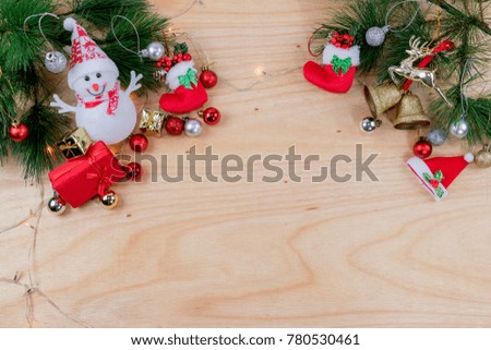 Top view Gift box and Christmas decorations and ornaments on wooden background