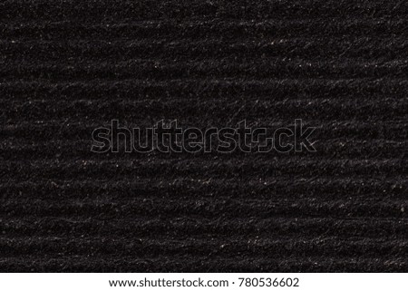 Black paper texture background with horizontal stripes. High resolution photo.