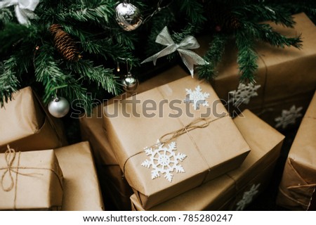 Christmas tree with gifts, rustic background. Christmas tree decorations. Close-up. New Year's atmosphere. Christmas composition. gifts boxes.