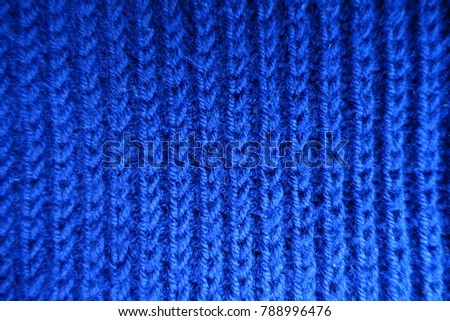 Bright blue handmade rib knit fabric from above