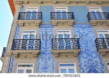 Historic facade in Porto decorated with blue hand painted tin-glazed tiles azulejo Porto, Portugal