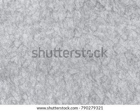 Texture of light gray wallpaper with a pattern. Silver paper surface, structure close-up.