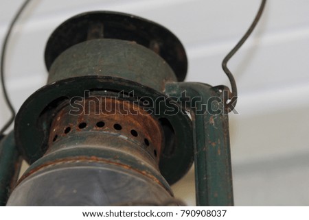 Up close macro green metal antique oil lamp top