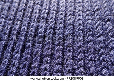 Macro of dark purple handmade knit fabric