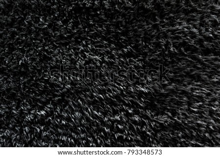 Black wool texture background, dark natural sheep wool, texture of white fluffy fur, fragment gray wool carpet, gray mat, grey rug