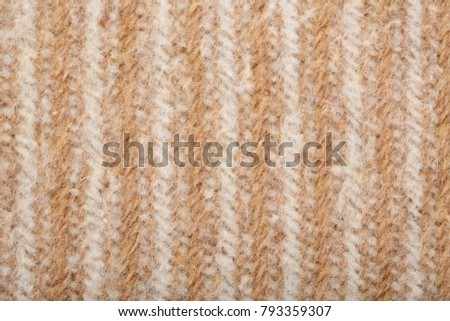 Woolen fabric close-up. Fabric in a geometric pattern.