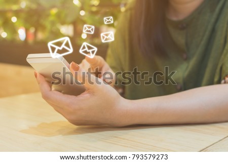 Woman hand using mobile phone with e-mail application, Concept email marketing and newsletter
