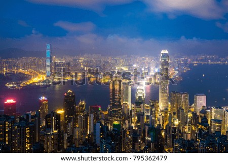 Hong Kong cityscape and Victoria Harbor at twilight, view from the Peak