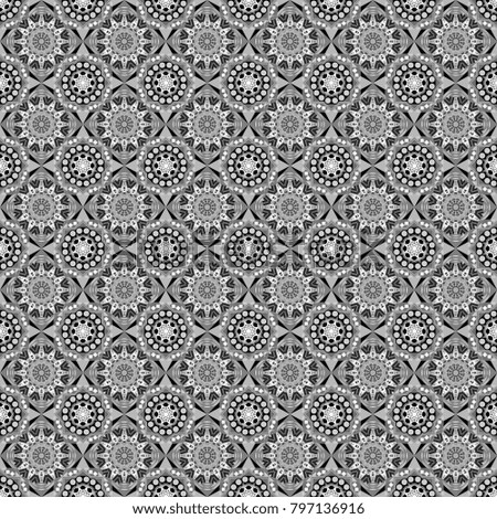 Geometric background with tribal tiles. Textile print for bed linen, jacket, package design, fabric and fashion concepts. Seamless pattern ethnic design in gray, black and white colors.