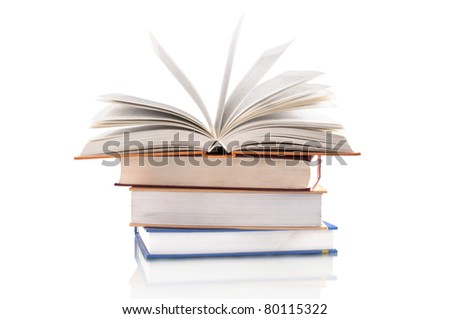 opening book on the stack of books