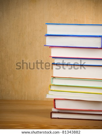 pile of new books on wood texture
