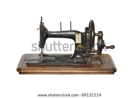 isolated antique sewing machine on white
