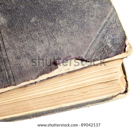 Thick old book on the background. In the closed position