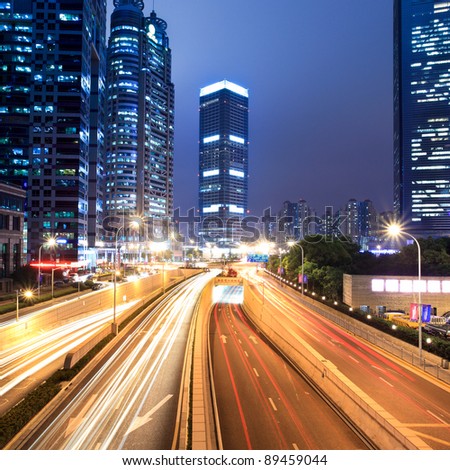 light trails on the modern street at night in shanghai lujiazui financial center,China.