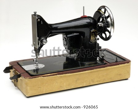 A vintage sewing machine against a white background