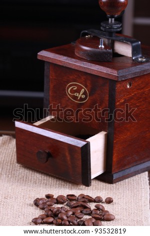 Roasted coffee beans with wooden Coffee grinder