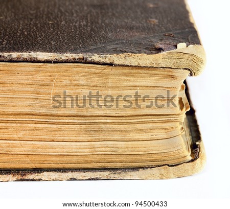Thick old book on the background. In the closed position
