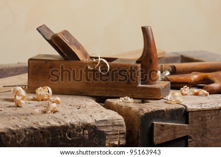 Wood planer and shavings at carpenters workshop